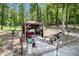 Relax in style with this backyard pergola featuring ample seating and lush wooded views at 2425 Wild Oak Ct, Stockbridge, GA 30281