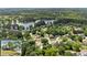 Aerial view of the neighborhood surrounding a pond in a wooded area at 2979 Overwood Sw Ln, Snellville, GA 30078