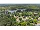 Aerial view of the neighborhood surrounding a pond in a wooded area at 2979 Overwood Sw Ln, Snellville, GA 30078