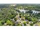 Aerial view of a neighborhood surrounding a pond at 2979 Overwood Sw Ln, Snellville, GA 30078