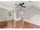 Bedroom with bright windows, wood look floors and a ceiling fan at 2979 Overwood Sw Ln, Snellville, GA 30078