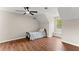 Bedroom with dark ceiling fan and wood look floors at 2979 Overwood Sw Ln, Snellville, GA 30078