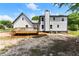 Exterior view of home showing white siding and wooden deck in backyard at 2979 Overwood Sw Ln, Snellville, GA 30078