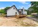 Exterior home view featuring a wooden deck and white siding at 2979 Overwood Sw Ln, Snellville, GA 30078