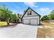 Elegant two-story house with a covered front porch and a spacious two-car garage, ideal for modern living at 2979 Overwood Sw Ln, Snellville, GA 30078