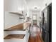 Modern kitchen with white cabinets, butcher block countertops, and stainless steel appliances at 2979 Overwood Sw Ln, Snellville, GA 30078