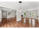 Open-concept living room featuring hardwood floors, a fireplace, and French doors leading to the deck at 2979 Overwood Sw Ln, Snellville, GA 30078