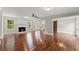 Spacious living room with gleaming hardwood floors, a fireplace, and natural light, creating a warm and inviting atmosphere at 2979 Overwood Sw Ln, Snellville, GA 30078