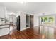 Bright living room with hardwood floors, natural light, and open layout flowing into the kitchen at 2979 Overwood Sw Ln, Snellville, GA 30078