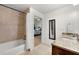 Modern bathroom featuring a bathtub with shower and granite countertops at 3300 Windy Ridge Se Pkwy # 1401, Atlanta, GA 30339