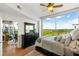 Bedroom featuring a large window with scenic views, hardwood floors, and contemporary furniture at 3300 Windy Ridge Se Pkwy # 1401, Atlanta, GA 30339