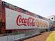 Large Coca-Cola Roxy advertisement painted on brick building adds a pop of color to the vibrant area at 3300 Windy Ridge Se Pkwy # 1401, Atlanta, GA 30339