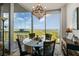 Elegant dining room with hardwood floors, chandelier, view, and sliding door to an outdoor balcony at 3300 Windy Ridge Se Pkwy # 1401, Atlanta, GA 30339