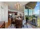 Well-lit dining room boasts hardwood floors, a round table, and is adjacent to the kitchen and living room at 3300 Windy Ridge Se Pkwy # 1401, Atlanta, GA 30339