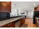 Kitchen with stainless steel appliances, dark cabinets, granite countertops, and black backsplash at 3300 Windy Ridge Se Pkwy # 1401, Atlanta, GA 30339