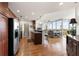 Open-concept kitchen featuring stainless steel appliances, dark wood cabinets, and an adjacent living area at 3300 Windy Ridge Se Pkwy # 1401, Atlanta, GA 30339