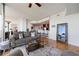 Bright living room with hardwood floors and large windows offering natural light and a comfortable seating area at 3300 Windy Ridge Se Pkwy # 1401, Atlanta, GA 30339