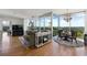 Bright living room features hardwood floors, floor to ceiling windows, neutral colors, and a decorative fireplace at 3300 Windy Ridge Se Pkwy # 1401, Atlanta, GA 30339