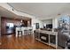 Open-concept living space with hardwood floors and an adjacent kitchen with bar seating at 3300 Windy Ridge Se Pkwy # 1401, Atlanta, GA 30339