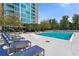 Relaxing outdoor swimming pool with lounge chairs for residents at 3300 Windy Ridge Se Pkwy # 1401, Atlanta, GA 30339