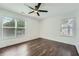 Bedroom with hardwood floors, neutral walls, and a window for natural light at 632 Warren Ave, Scottdale, GA 30079