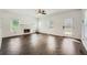 Bright living room featuring a fireplace, large windows, and herringbone floors at 632 Warren Ave, Scottdale, GA 30079