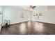 Large living room with lots of natural light, herringbone floors, and access to outdoor space at 632 Warren Ave, Scottdale, GA 30079
