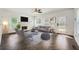 Cozy living room with a fireplace, ample windows, and modern furnishings at 632 Warren Ave, Scottdale, GA 30079