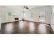 Bright living room featuring wood floors, a fireplace and a ceiling fan at 632 Warren Ave, Scottdale, GA 30079