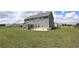 Expansive backyard showcasing the home's exterior, patio area, and well-maintained lawn at 125 Leveret Rd, Locust Grove, GA 30248