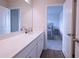 Bathroom with a view into an adjacent bedroom and white cabinets at 125 Leveret Rd, Locust Grove, GA 30248