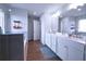 Bright bathroom showcasing a double sink vanity, wood flooring, and a walk-in shower at 125 Leveret Rd, Locust Grove, GA 30248
