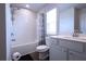 Clean bathroom with a tiled shower-tub combo, modern fixtures, and a sleek vanity with ample storage at 125 Leveret Rd, Locust Grove, GA 30248