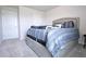 Inviting bedroom with a neatly made bed, soft gray carpet, and plenty of space at 125 Leveret Rd, Locust Grove, GA 30248