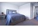Comfortable bedroom with plush bedding and a calming color scheme at 125 Leveret Rd, Locust Grove, GA 30248
