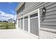 Attached garage featuring stylish doors and coordinated exterior elements at 125 Leveret Rd, Locust Grove, GA 30248