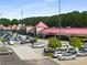 View of the shopping center with a variety of shops, parking and easy access for shoppers at 125 Leveret Rd, Locust Grove, GA 30248