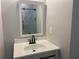 Bathroom vanity with a modern sink, sleek fixtures, and a framed mirror at 2257 Rocksram Ct, Buford, GA 30519