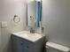 Neat bathroom showcasing a gray vanity, countertop, and toilet at 2257 Rocksram Ct, Buford, GA 30519