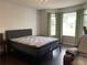 Bright bedroom featuring large windows and a comfortable bed, perfect for relaxation at 2257 Rocksram Ct, Buford, GA 30519