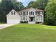 Traditional two-story home with a well-manicured lawn and inviting front entrance at 2257 Rocksram Ct, Buford, GA 30519