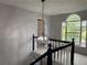 Open staircase with decorative lighting fixture and stained glass window at 2257 Rocksram Ct, Buford, GA 30519