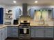 Stylish kitchen featuring stainless steel appliances, ample counter space and updated cabinets at 2257 Rocksram Ct, Buford, GA 30519