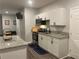 Modern kitchen with white cabinets, stainless steel appliances, and granite countertops at 2257 Rocksram Ct, Buford, GA 30519