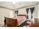 Comfortable bedroom featuring a spacious layout, neutral tones, and trey ceiling at 4326 Megan Manor Sw Dr, Powder Springs, GA 30127