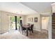 Cozy dining area with a modern chandelier and access to a backyard patio at 4326 Megan Manor Sw Dr, Powder Springs, GA 30127