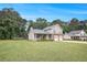Well-maintained home with a sprawling lawn, perfect for outdoor activities and Gathering enjoyment at 4326 Megan Manor Sw Dr, Powder Springs, GA 30127