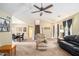 Open-concept living space with a dining area and staircase, creating a seamless flow for modern living at 4326 Megan Manor Sw Dr, Powder Springs, GA 30127