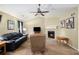 Bright living room featuring a fireplace and a comfortable seating area, ideal for Gathering gatherings at 4326 Megan Manor Sw Dr, Powder Springs, GA 30127