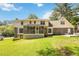 The backyard has a well-manicured lawn, a screened porch, and a patio at 5152 Clearwater Dr, Stone Mountain, GA 30087